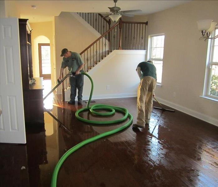 SERVPRO teams set drying equipment to dry home after water loss 