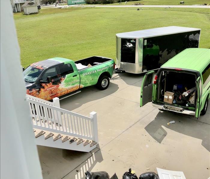 SERVPRO vehicles on the scene of a water loss