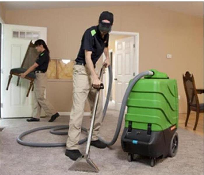 SERVPRO employees cleaning carpet