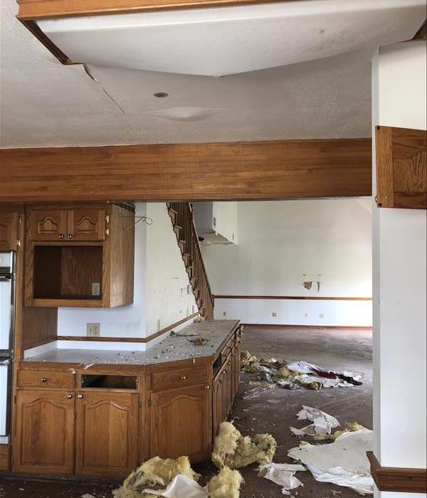 inside home with ceiling damage