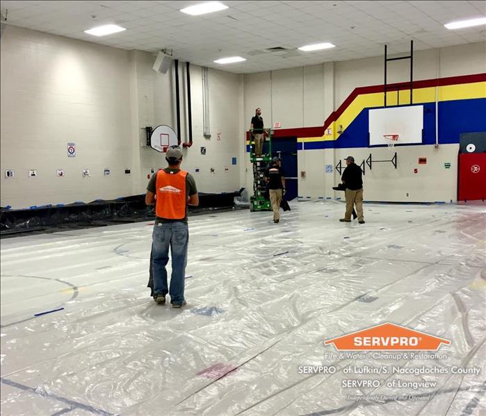 SERVPRO workers in large building 