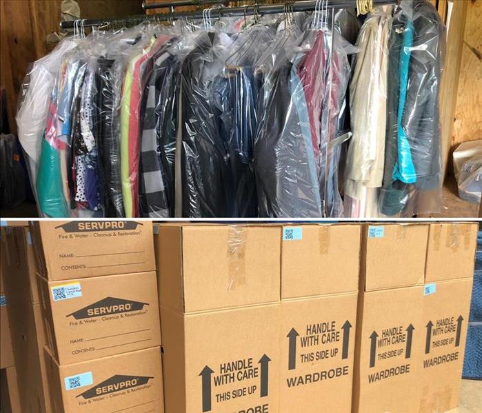 dry cleaned clothes hanging on rack and garment boxes