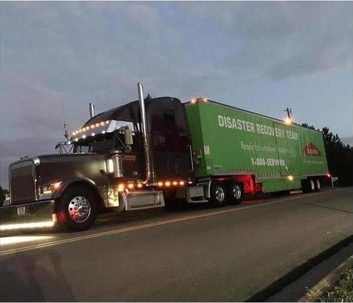 A SERVPRO truck on the highway.