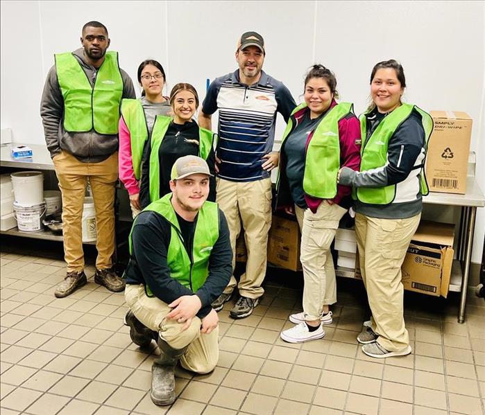 SERVPRO technicians after cleaning a commercial building