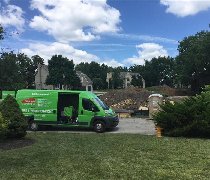 SERVPRO Disaster Recovery Fleet in Front of Structure