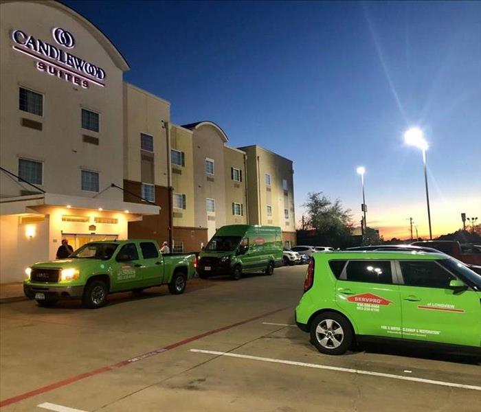 SERVPRO vehicles in front of hotel